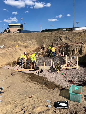 The new forebay, or reservoir, being formed prior to concrete being poured. The area where construction is taking place is an area of excavated dirt.