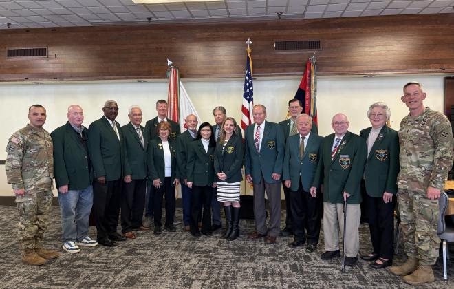Jessie Kimber at the Fort Carson Good Neighbor induction ceremony, with previous inductees and enlisted from Fort Carson.