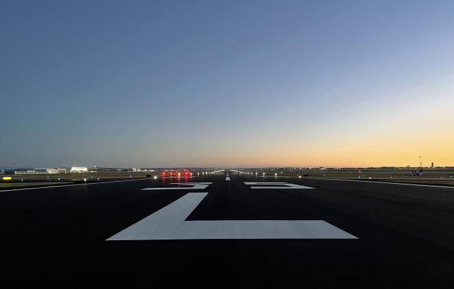 newly resurfaced runway with bright white striping 